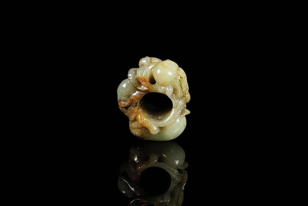 Lot 337: A Chinese Jade Carving of a Coiled Chilong...
