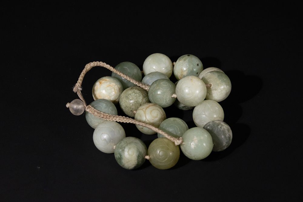 Lot 358: A Chinese Jade Necklace with Carved Spiral-Motif Beads.