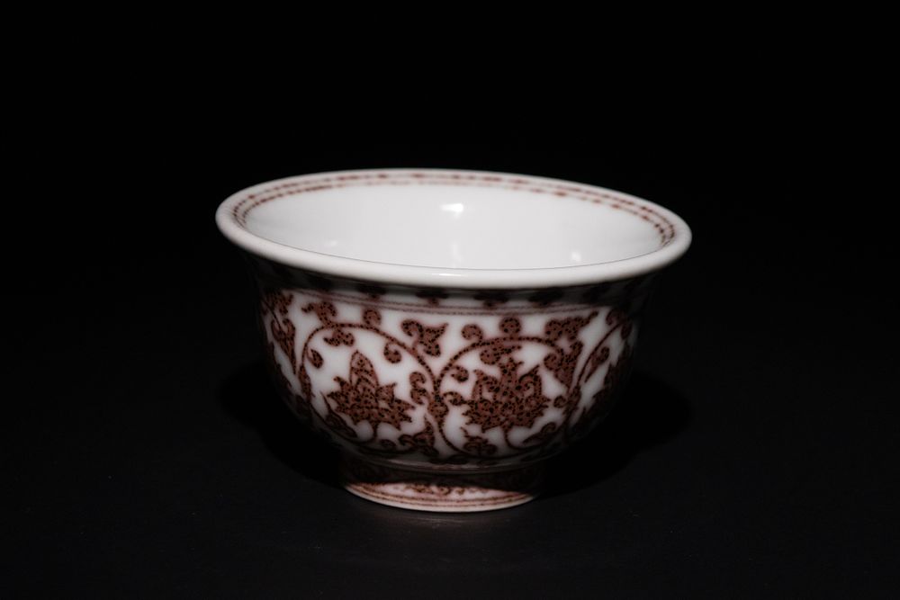 Lot 450: A Chinese Porcelain Bowl with Red Floral Motif.