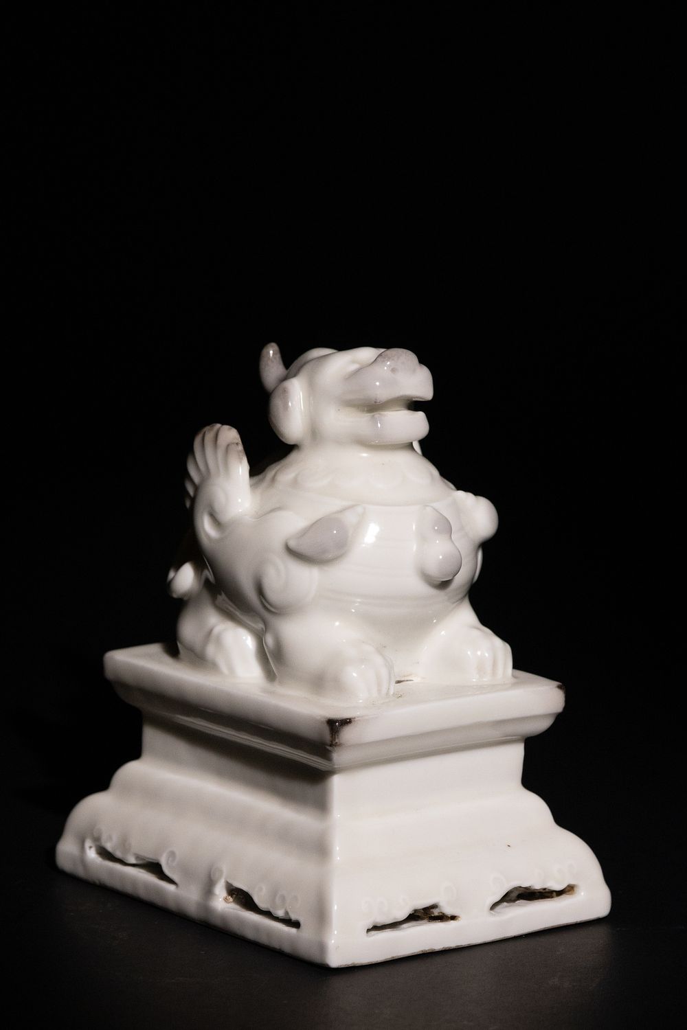 Lot 453: A Chinese Blanc-de-Chine Porcelain Foo Dog Figure on...