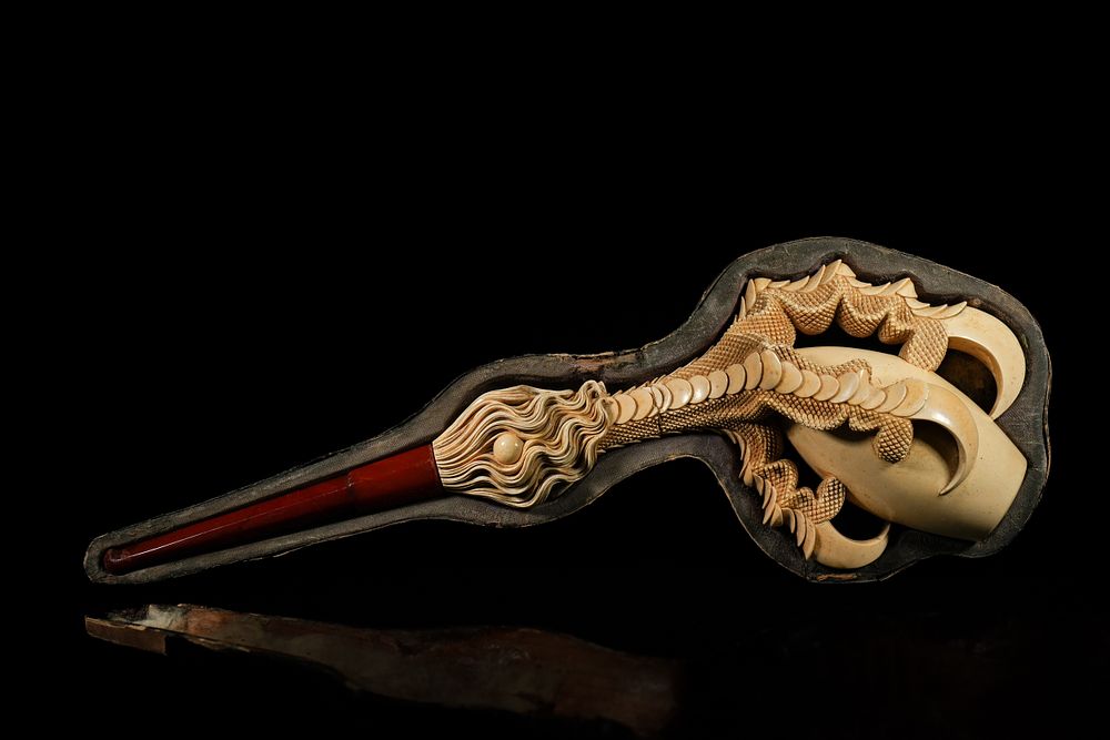 Lot 471: An Amber Smoking Pipe with Carved Talon Bowl,...