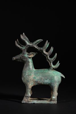 A Luristani Bronze Stag, Circa 1200–800 BCE. Cast in bronze, the stylised stag stands on an 