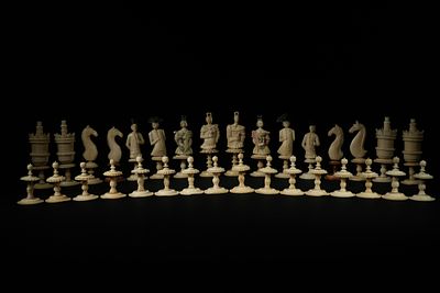 A German Geislingen Bone Figural Chess Set, Representing Two European Armies, 18th Century. An 