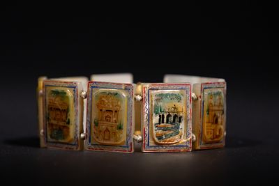A Persian Mother-of-Pearl Bracelet with Painted Enamel Scenes, 20th Century. Composed of 