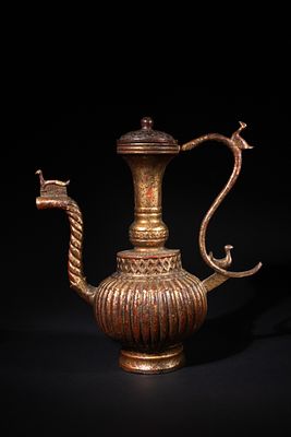An Indian Bronze Ewer (Aftaba) - An Indian bronze ewer (aftaba). The vessel features a fluted 