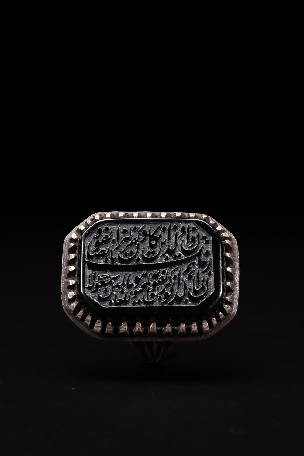 Lot 163: An Islamic Silver Ring with Rectangular Black Stone...