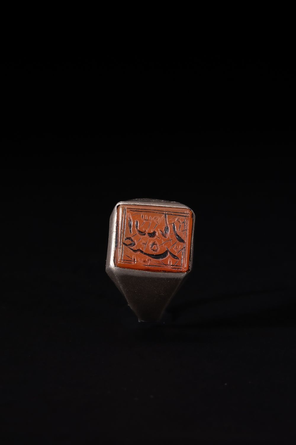 Lot 167: An Islamic Silver Ring with Square Agate Intaglio...