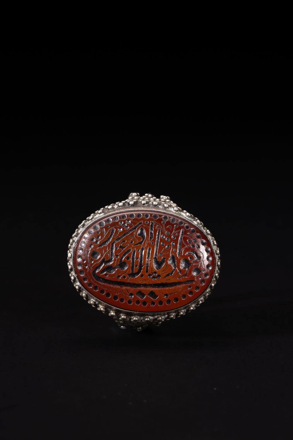 Lot 168: An Islamic Silver Ring with an Oval Agate...