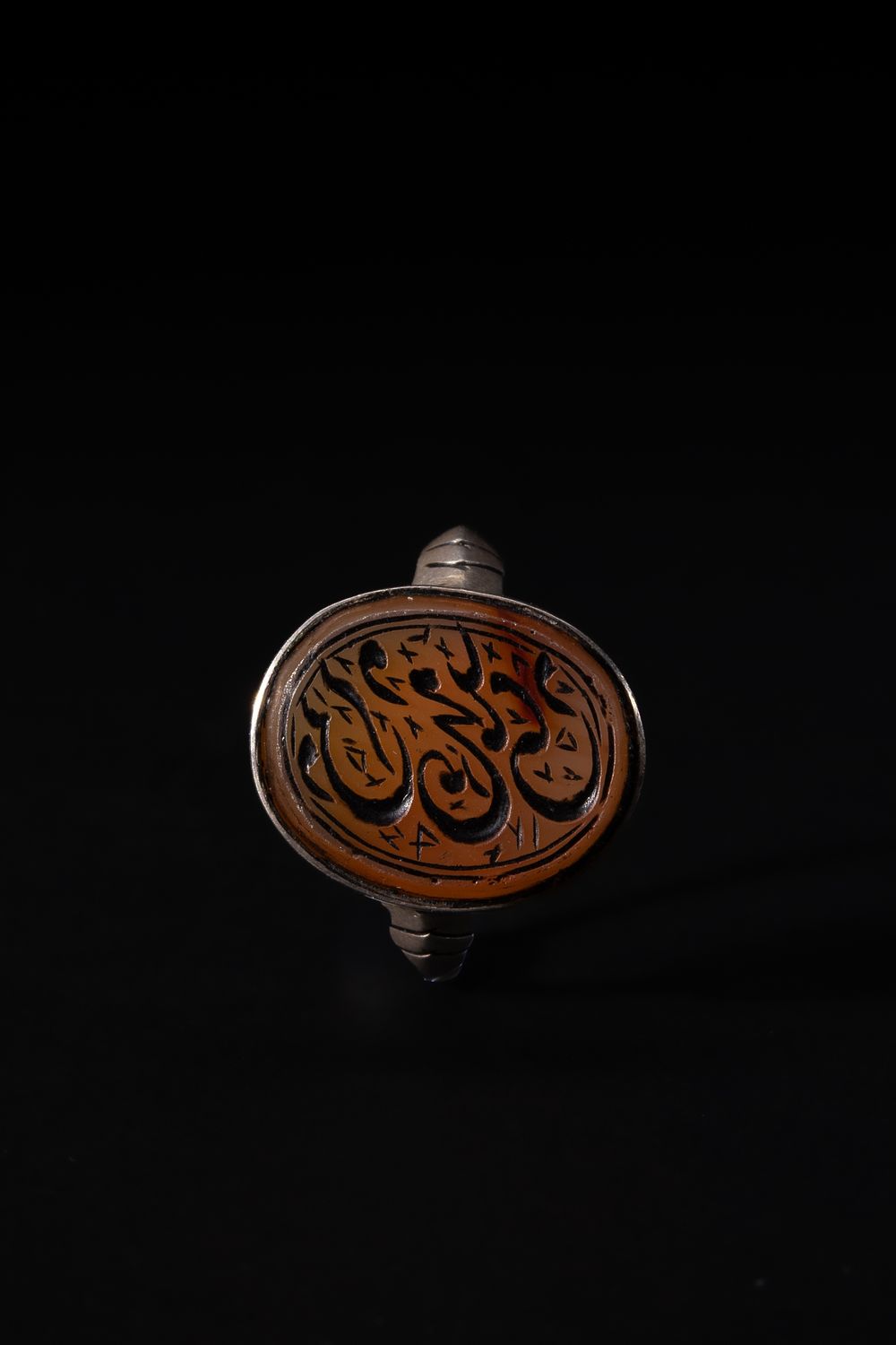 Lot 169: An Islamic Silver Ring Set with an Oval...