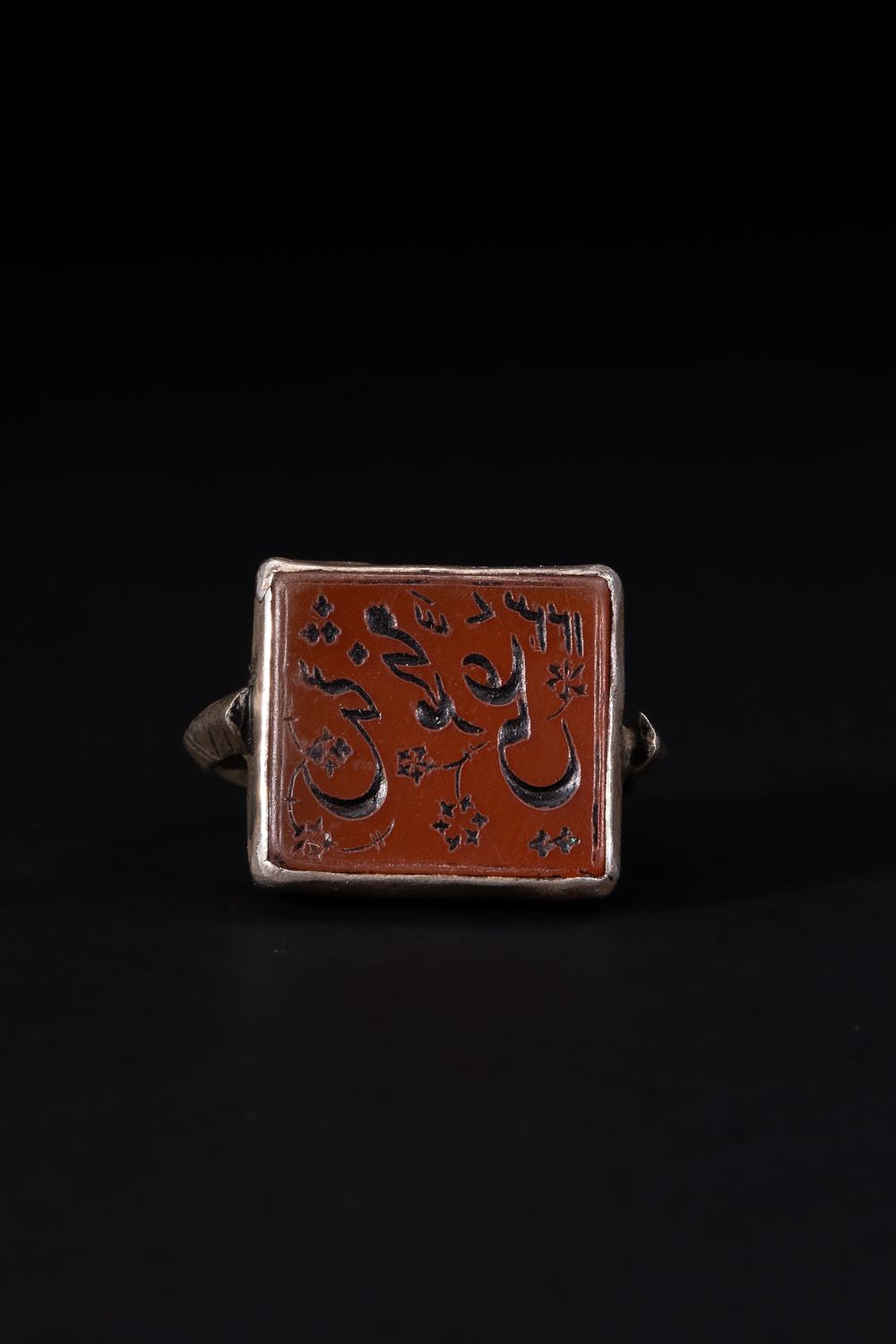 Lot 170: An Islamic Silver Ring Set with a Square...