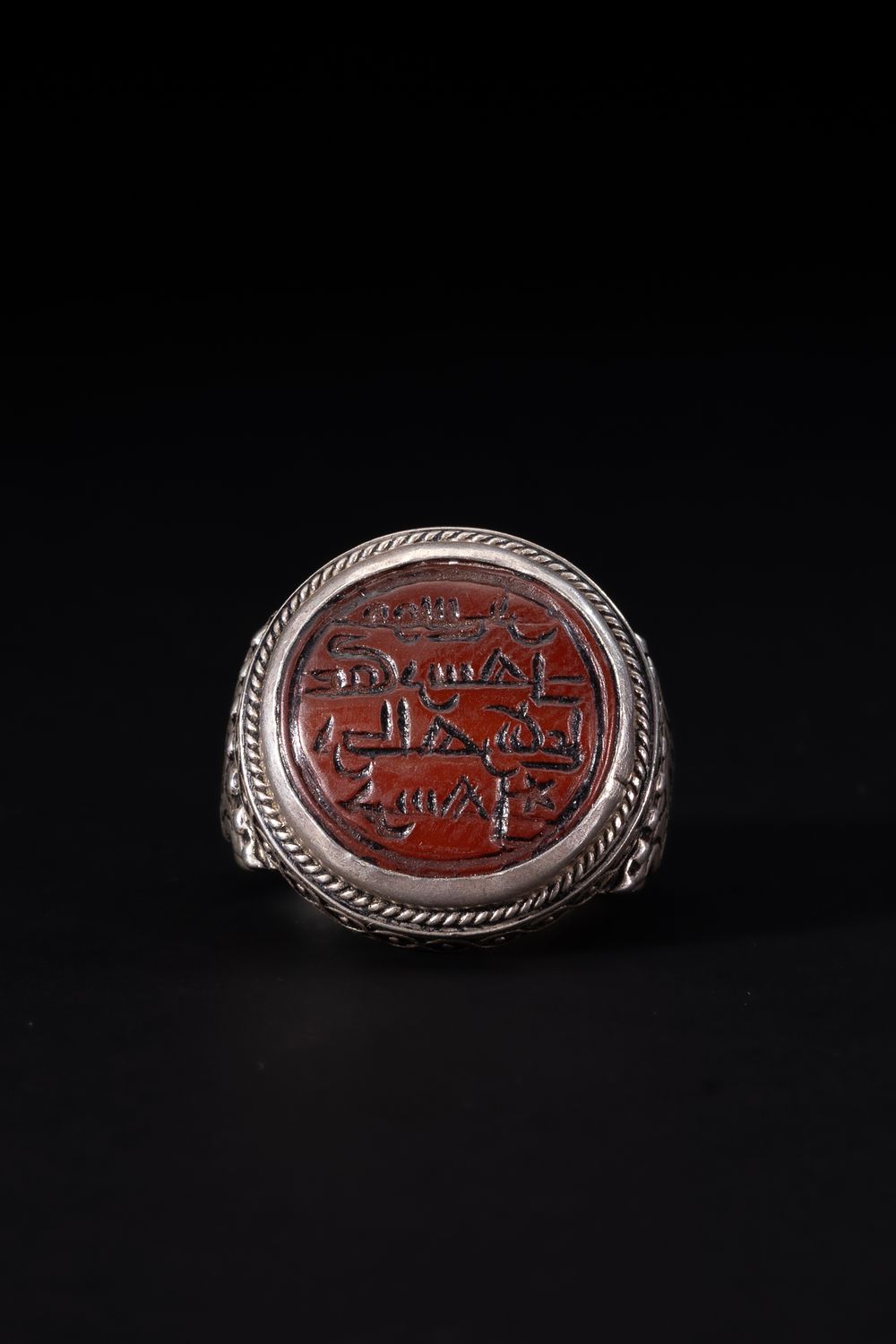 Lot 171: An Islamic Silver Ring Set with a Round...