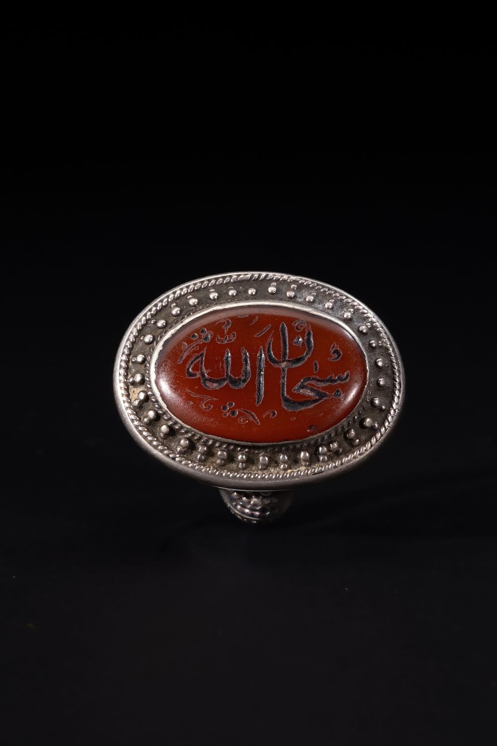 Lot 172: An Islamic Silver Ring Set with an Oval...