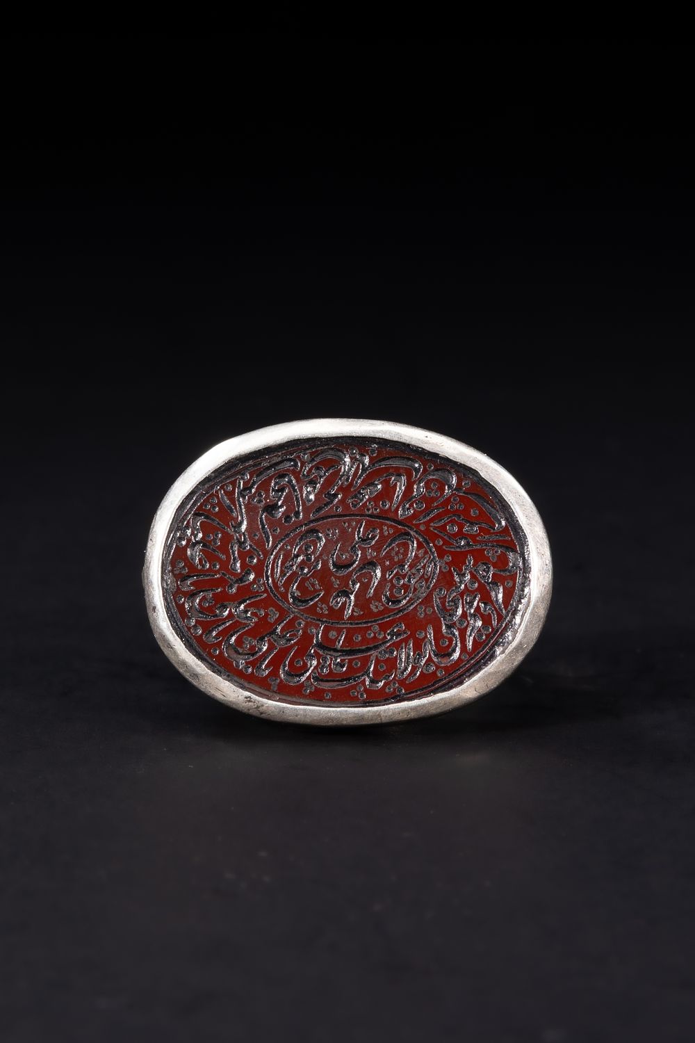 Lot 173: An Islamic Silver Ring Set with an Oval...