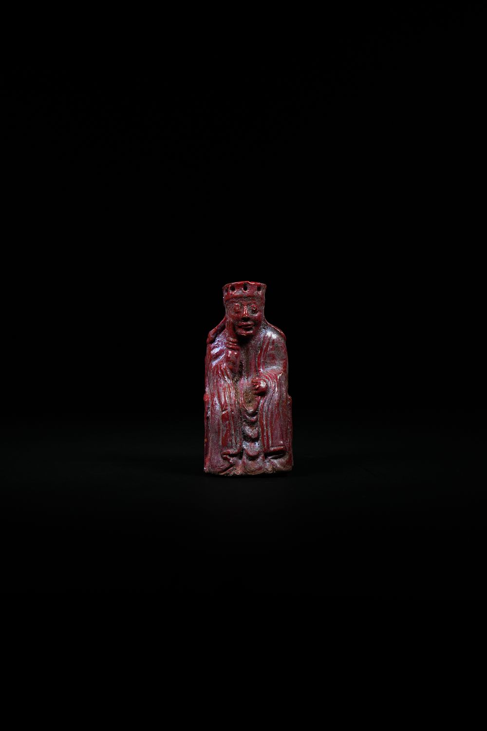 Lot 190: A Ceramic Chess Piece Depicting a Seated King,...