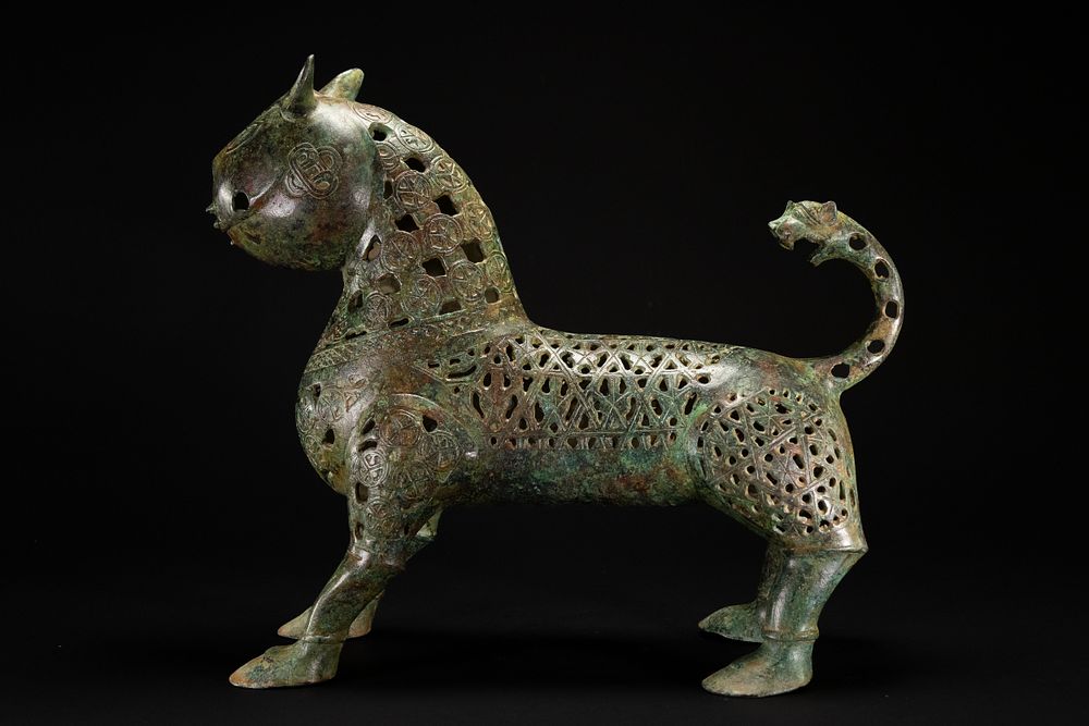 Lot 205: A Khorassan Style Openwork Bronze Zoomorphic Figure.