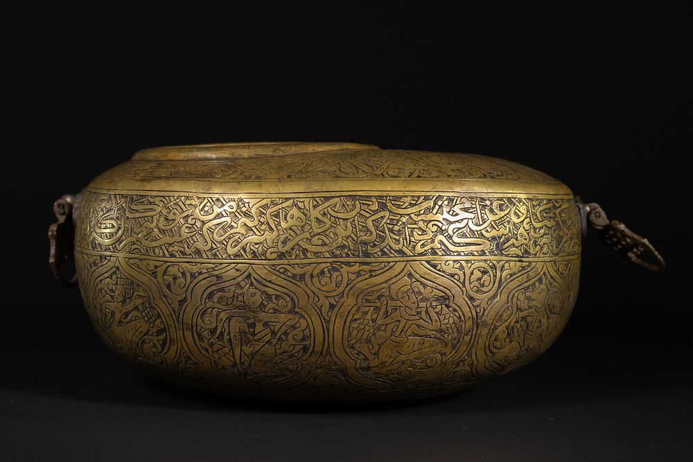 Lot 206: A Qajar Brass Kashkul Beggar’s Bowl with Figural...