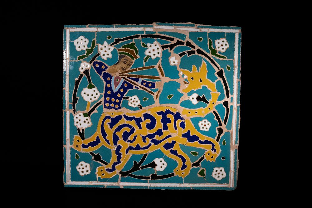 Lot 221: A Persian Isfahan Mosaic Tile Depicting a Hunter...