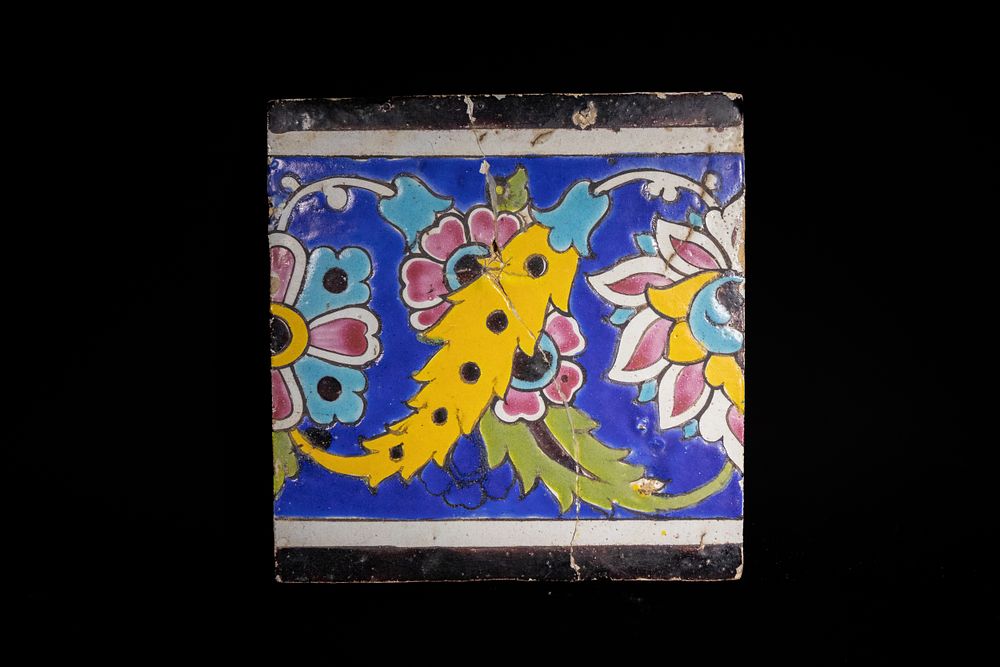 Lot 222: A Qajar or Zand Polychrome Tile with Floral...