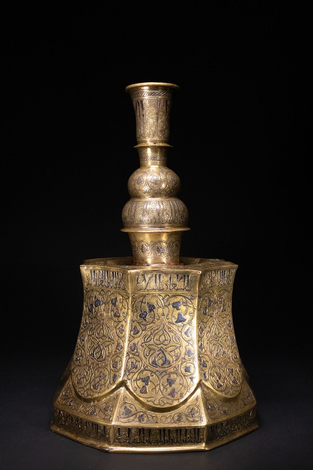 Lot 232: An Islamic Brass Candle Stand with Silver and...