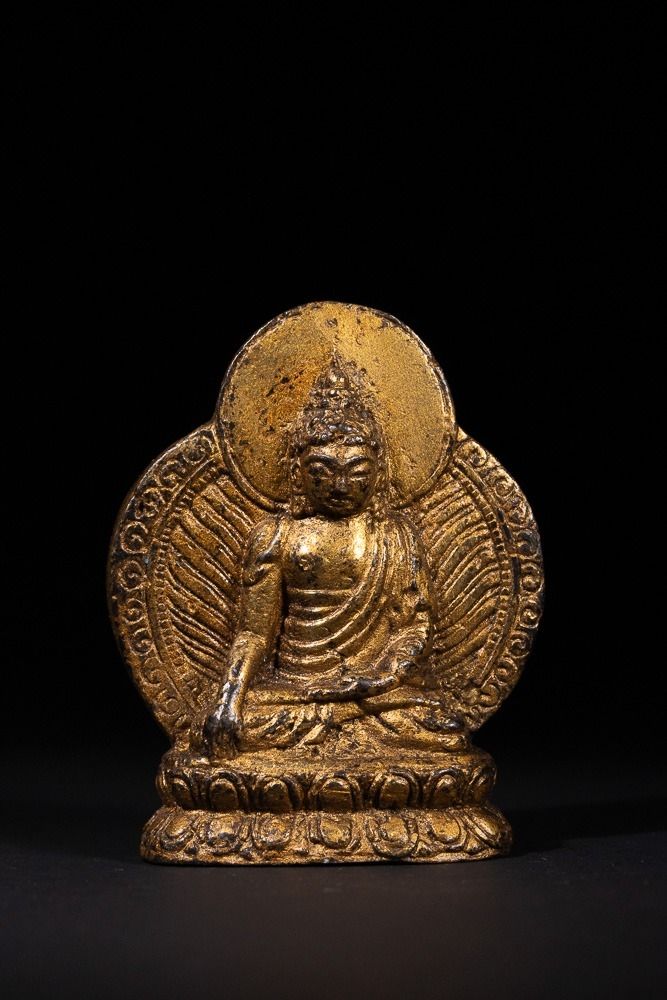 Lot 240: A Tibetan Gilt-Bronze Figure of Shakyamuni Buddha -...