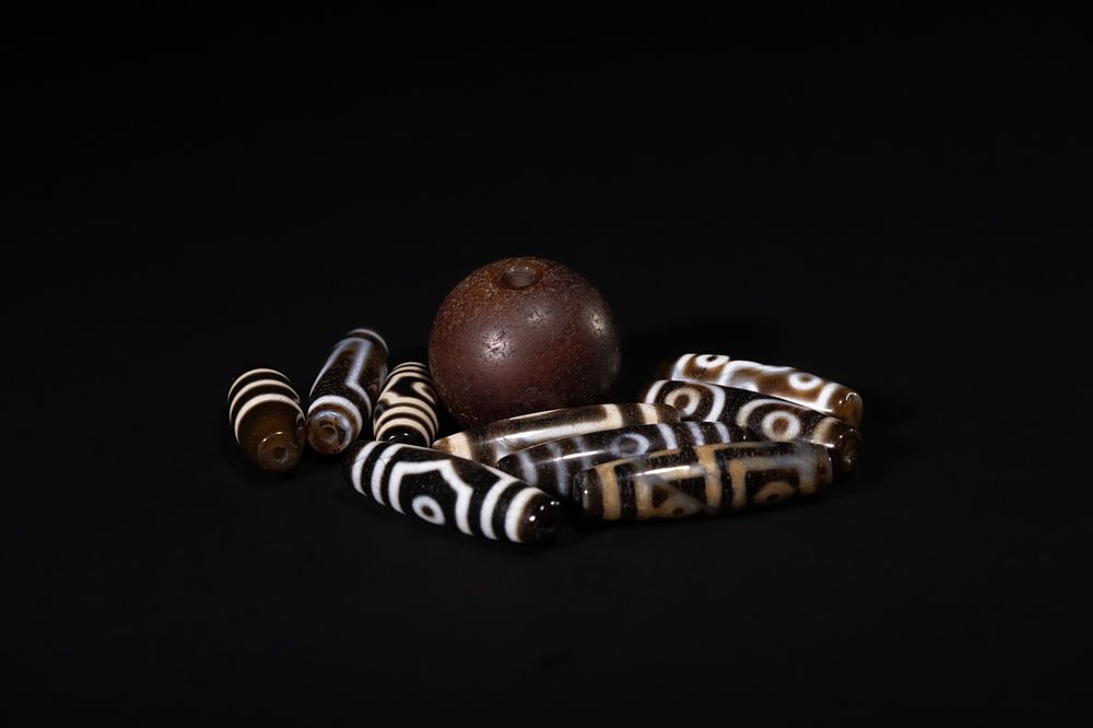 Lot 244: A Lot of Ten Tibetan Agate Dzi Beads,...