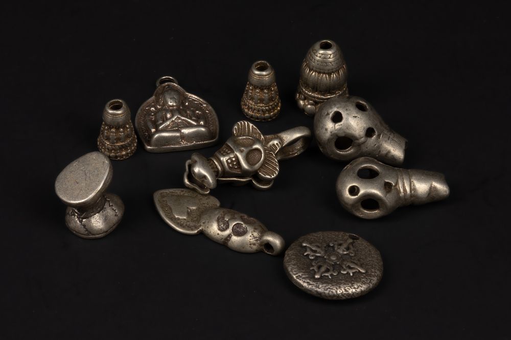 Lot 249: A Collection of Tibetan Mixed-Metal Ritual and Amuletic...