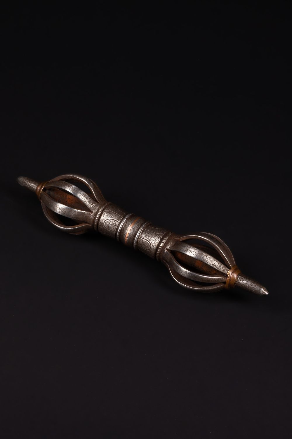 Lot 252: A Tibetan Iron Vajra (Dorje) with Copper Inlay.
