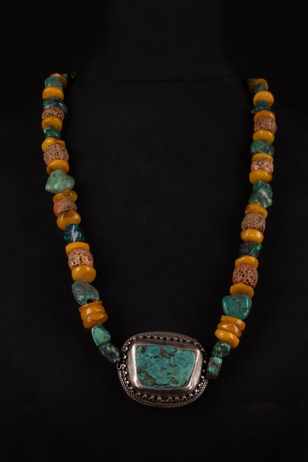 Lot 256: A Tibetan Turquoise and White Metal Beaded Necklace.