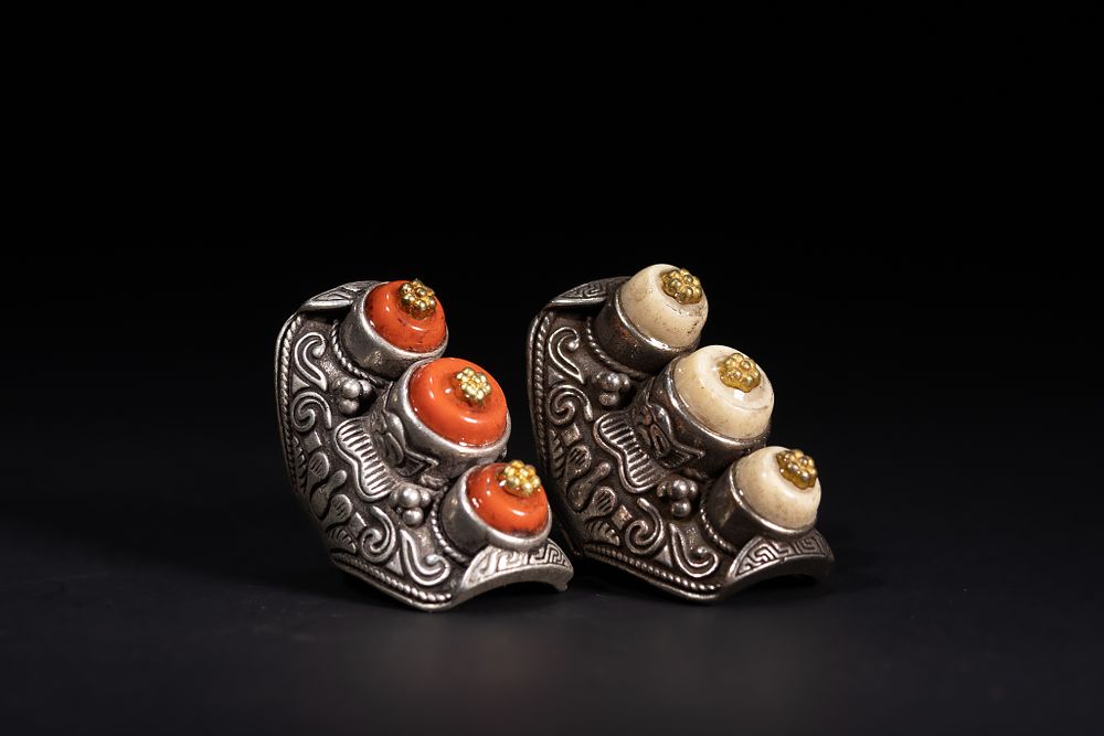Lot 261: A Pair of Tibetan White Metal Rings Set...