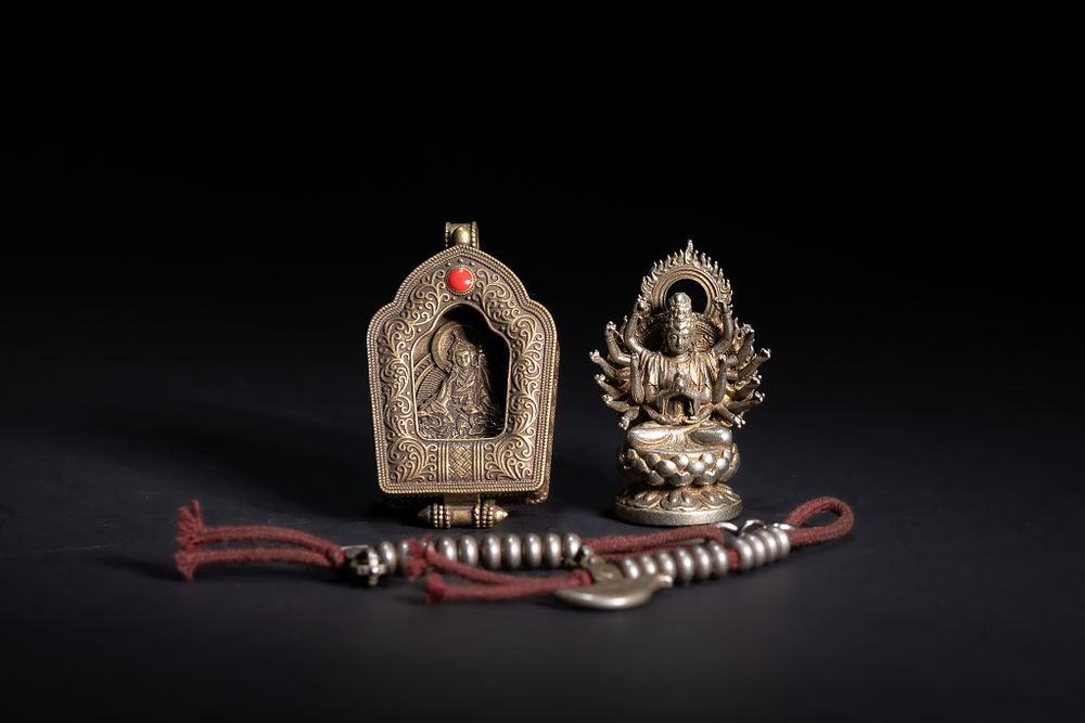 Lot 263: A Tibetan Buddhist Metal Shrine Pendant, Deity Figure,...