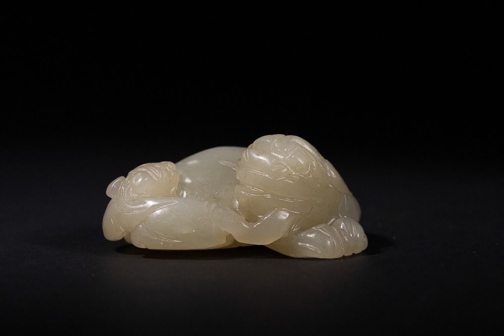 Lot 326: A Chinese White Jade 'Auspicious Beast' - A...
