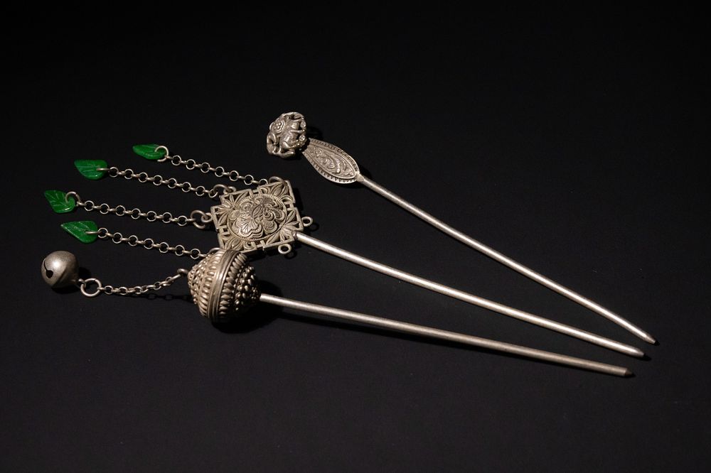 Lot 343: A Lot of Three Chinese White Metal Hairpins...