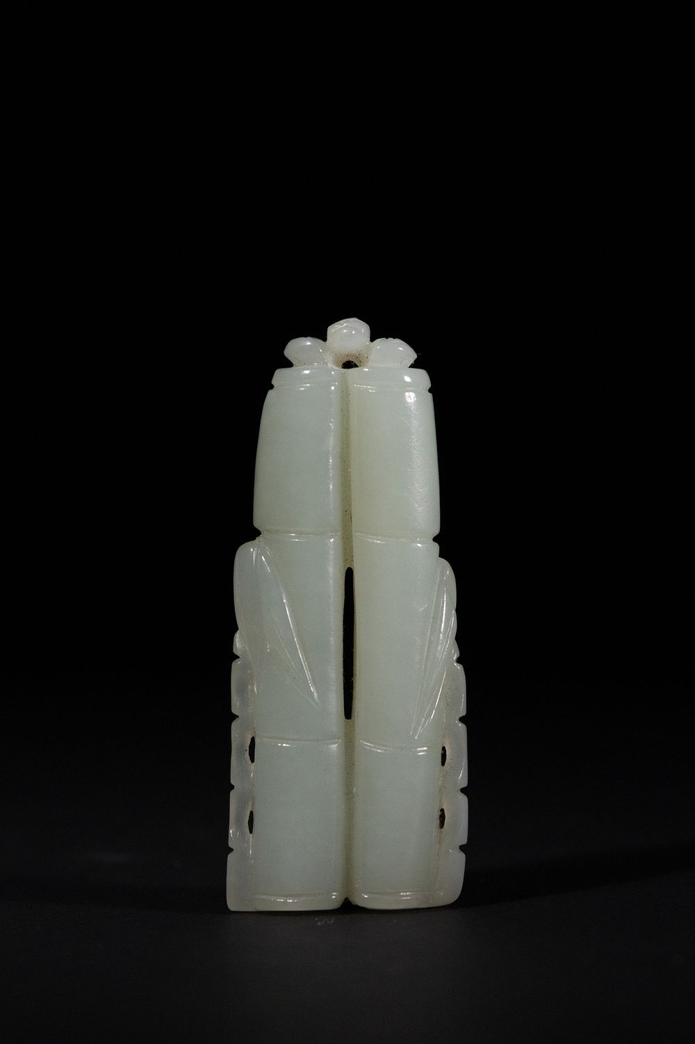 Lot 381: A Chinese White Jade Double-Gourd Pendant.