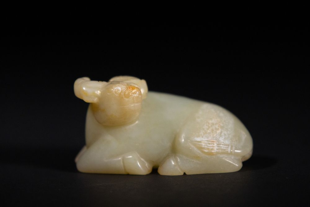 Lot 382: A Chinese Jade Carving of a Recumbent Buffalo.