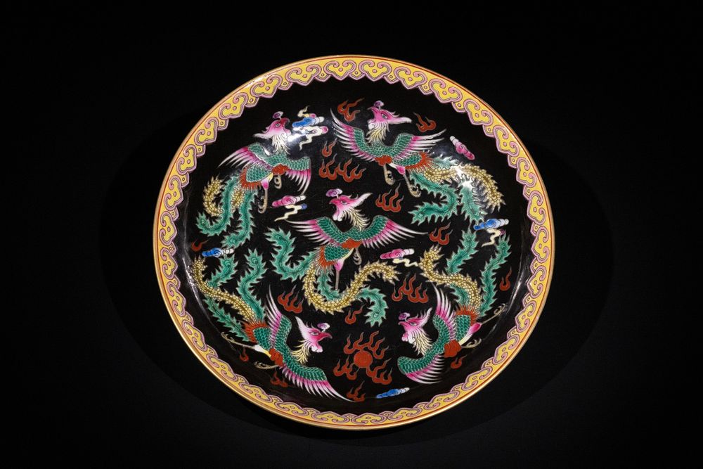Lot 386: A Chinese Famille Noire Dish with Phoenix and...
