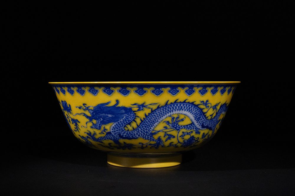 Lot 391: A Chinese Imperial Yellow Ground Dragon Porcelain Bowl...