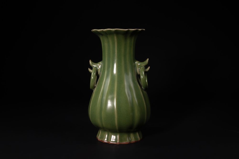Lot 399: A Chinese Green-Glazed Baluster Vase with Ring Handles.