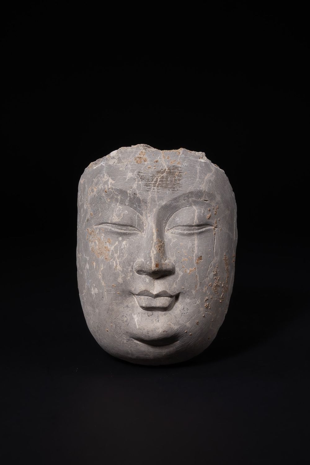 Lot 402: A Chinese Carved Stone Head Fragment, Possibly Ancient.