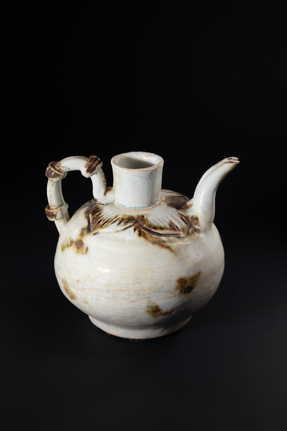 Lot 411: A Chinese White-Glazed Ceramic Ewer with Loop Handle...