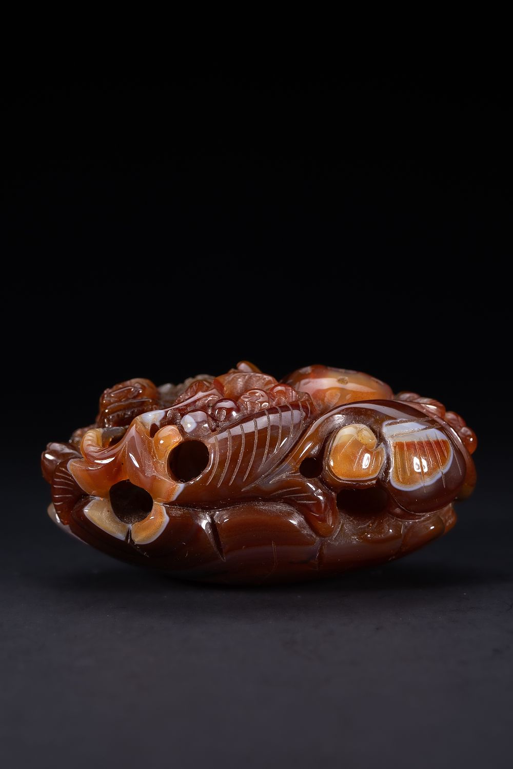 Lot 416: A Chinese Carved Agate Mythical Beast Ornament.