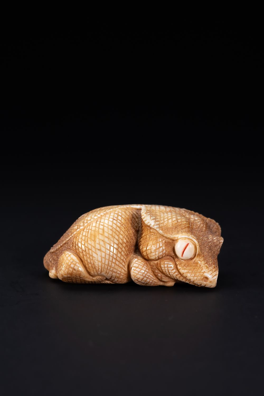 Lot 419: A Chinese Carved Horn Recumbent Mythical Beast Figure.