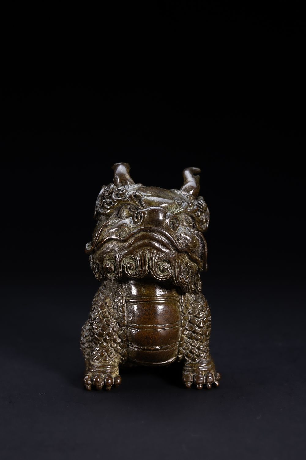 Lot 420: A Chinese Bronze Model of a Mythical Guardian...
