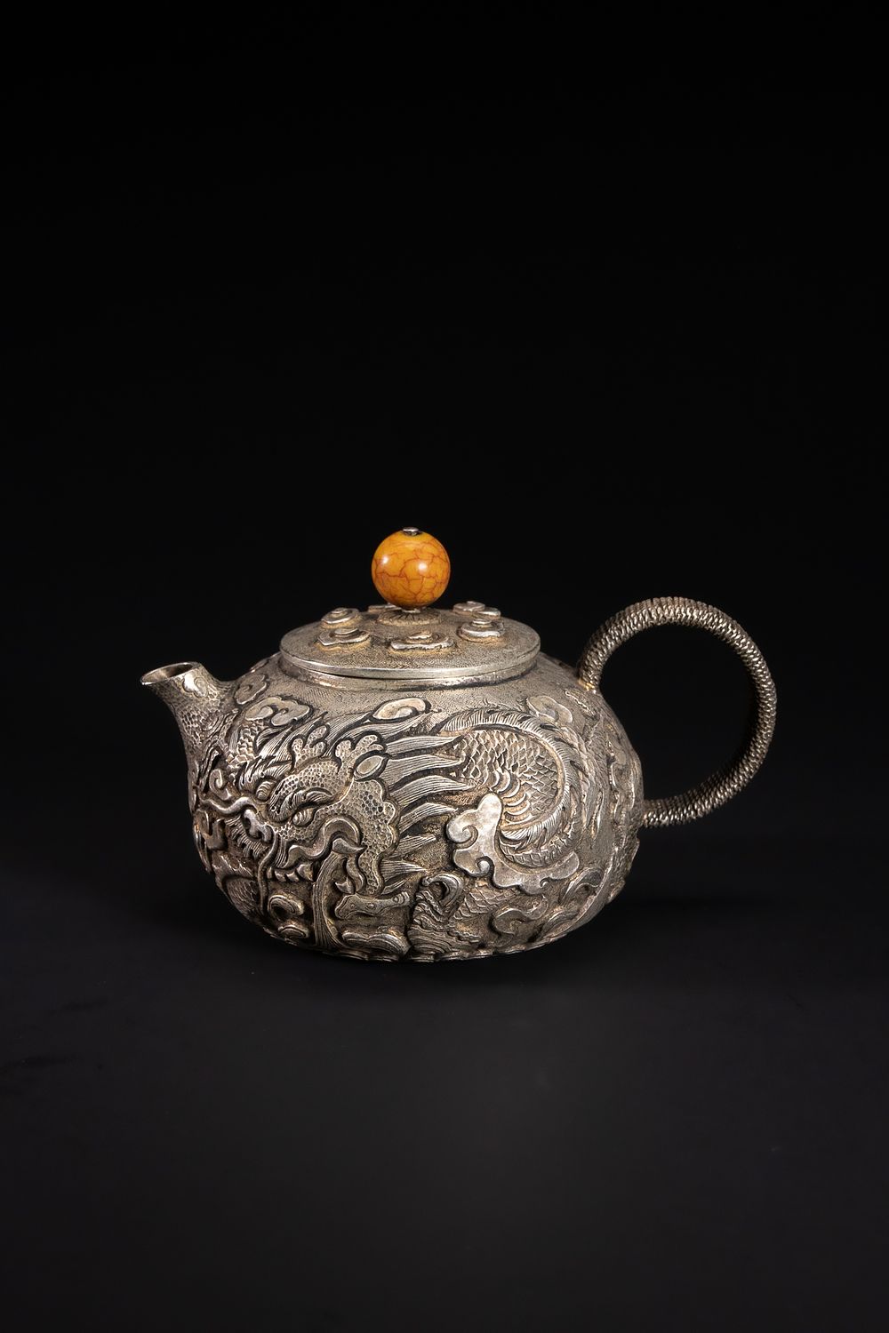 Lot 431: A Chinese White Metal Dragon-Decorated Teapot with Amber-Coloured...