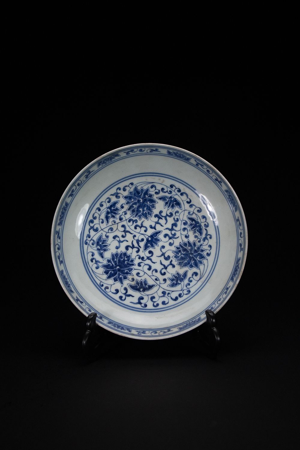 Lot 446: A Chinese Blue and White ‘Lotus Scroll’ Dish,...