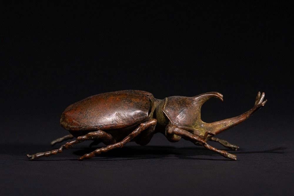 Lot 467: A Japanese Bronze Rhinoceros Beetle Okimono with Articulated...