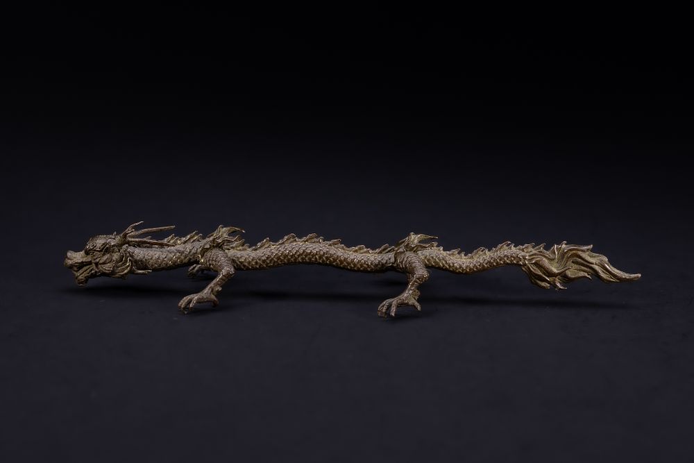 Lot 468: A Japanese Bronze Figure of a Dragon.
