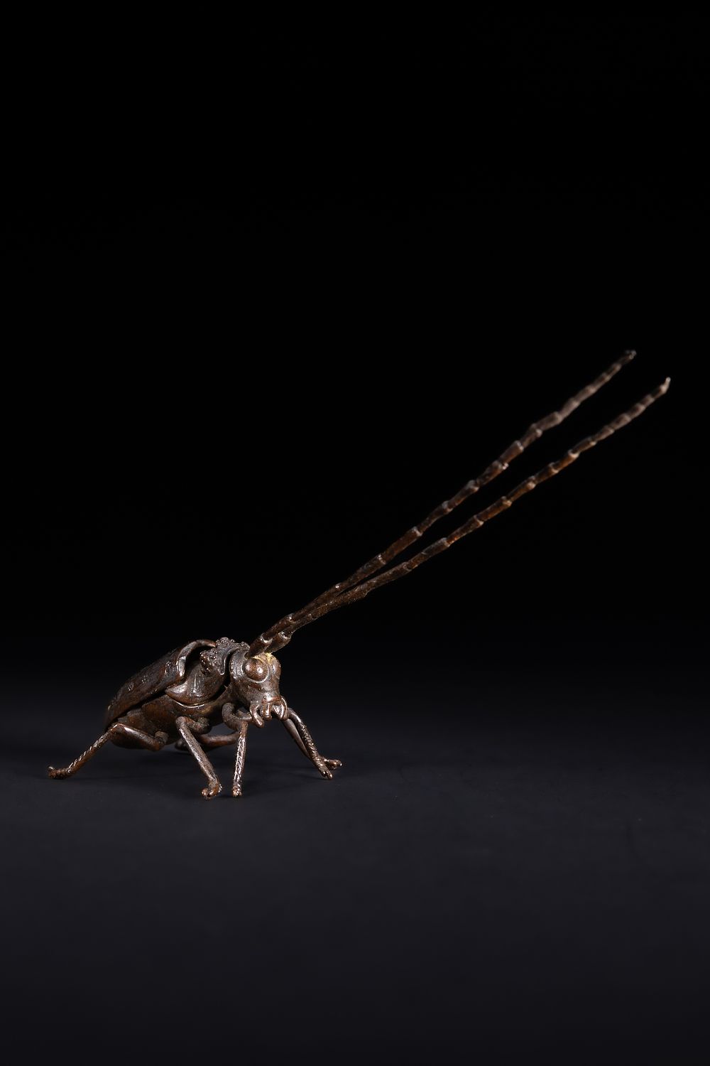 Lot 471: A Japanese Bronze Figure of a Longhorn Beetle.