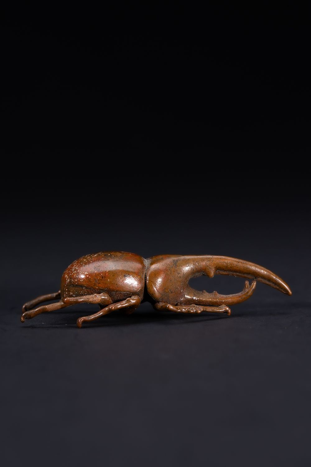 Lot 476: A Japanese Bronze Model of a Stag Beetle.