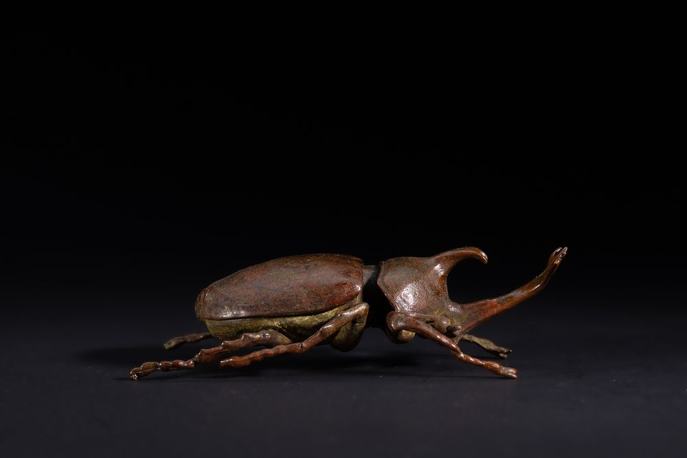 Lot 482: A Japanese Bronze Model of a Stag Beetle.