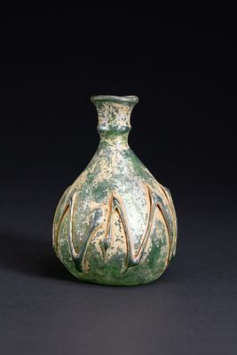 A Roman Green Glass Flask with Trailed Decoration, Circa 1st–3rd Century AD. Free-blown glass 
